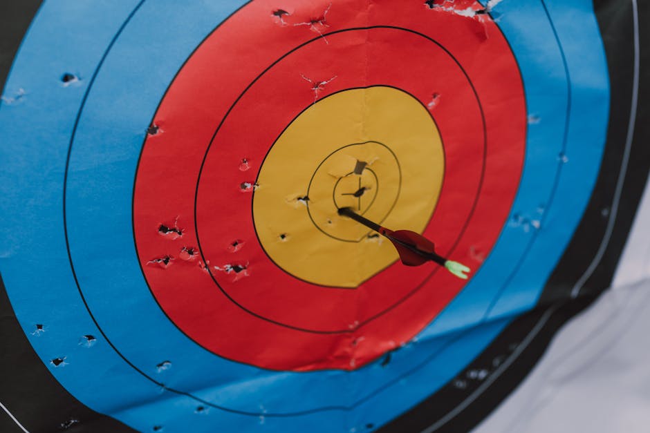 Arrows clustered tightly on a target — a metaphor for well-calibrated probability forecasts