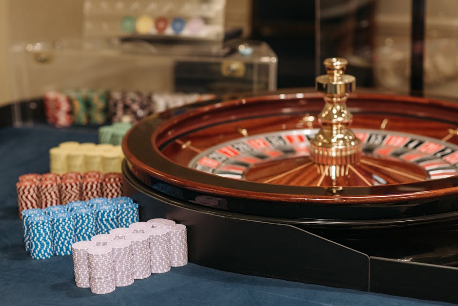 Casino roulette wheel with chips on a green felt table