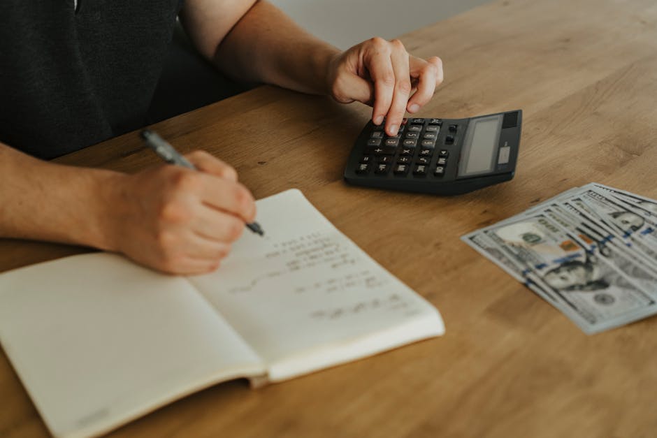 Expected value calculation laid out on paper with calculator