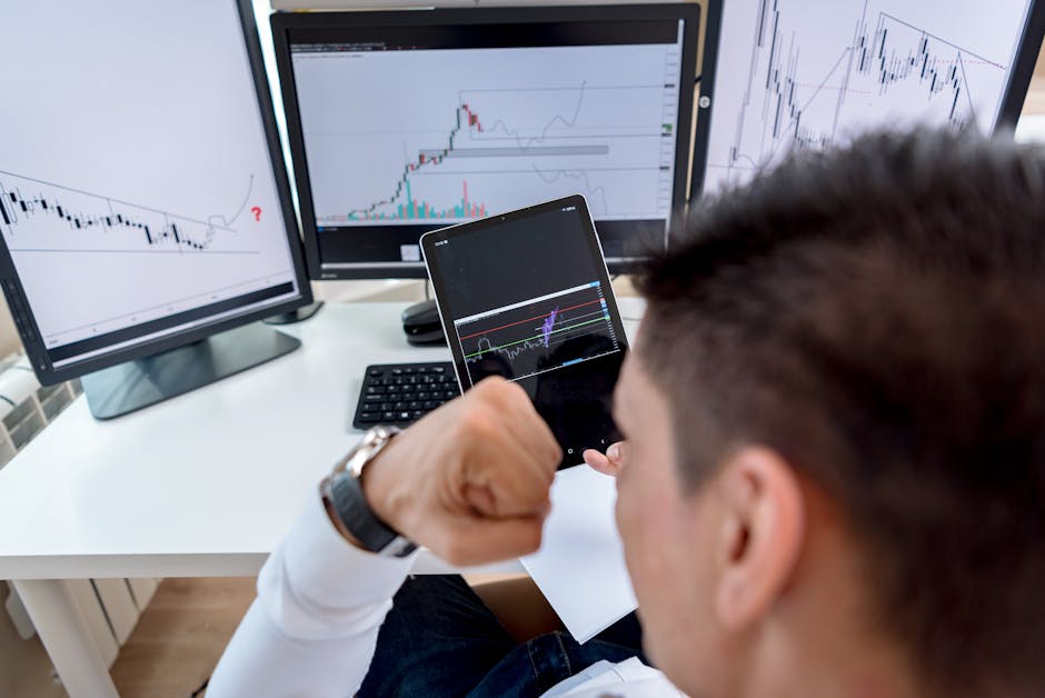 Investor staring confidently at multiple trading screens