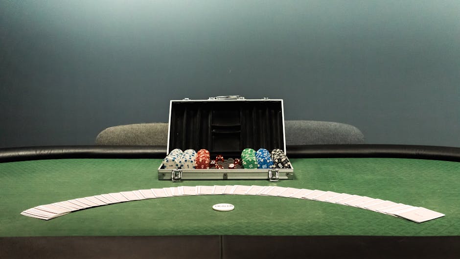 Poker chips and playing cards on a felt table